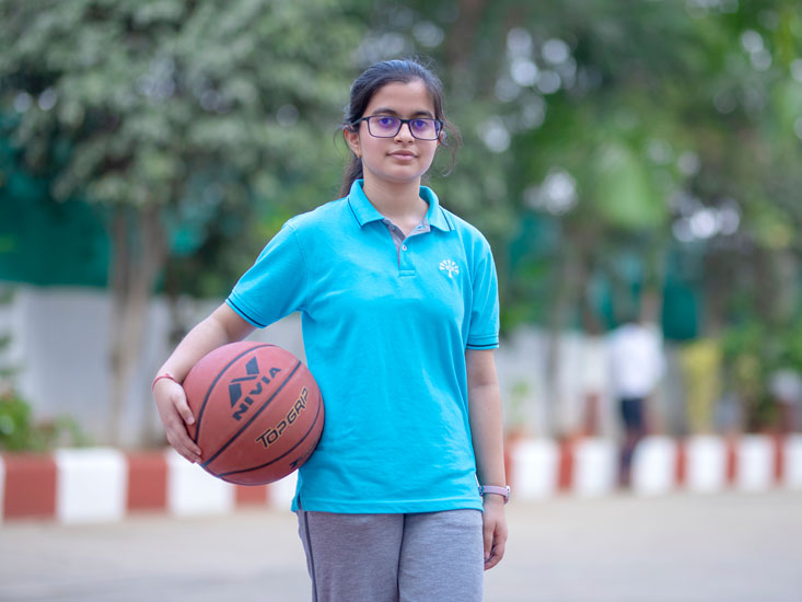 students participating in basketball at podar education school
